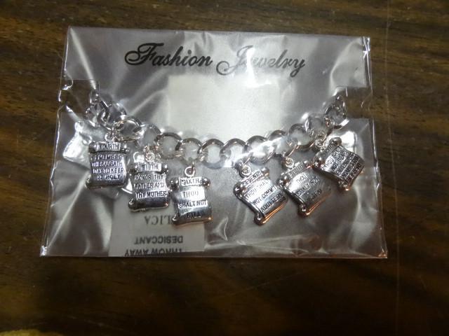 lot 99 image: Ten commandments bracelets. Qty 50...