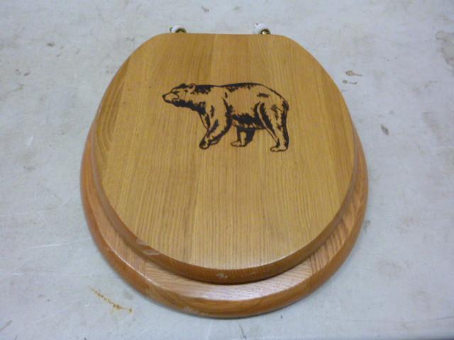 lot 28 image: Bear Wooden Toilet Seat...