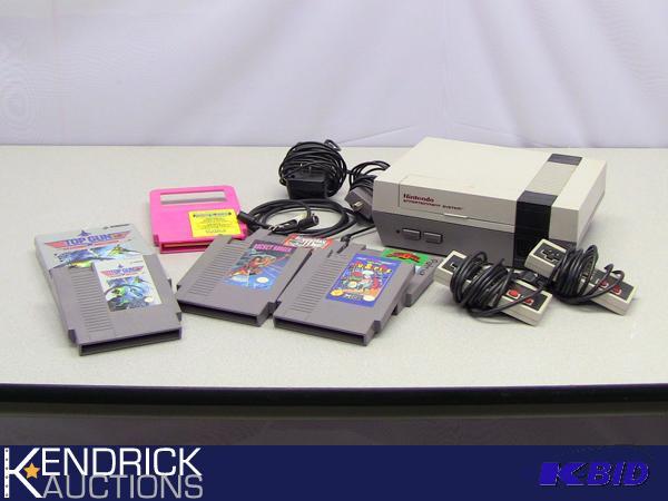 lot 69 image: Vintage NES Nintendo Gaming System and Games