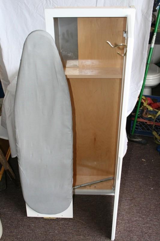 Fold out ironing board and cabinet,...