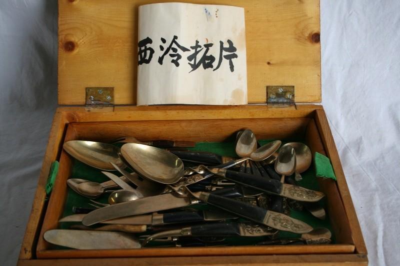 Antique silverware set in box, says...