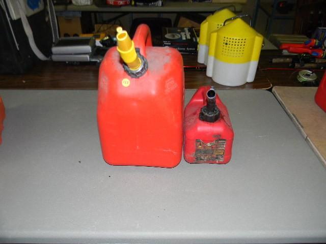 lot 123 image: Lot of 2 gas cans - 1 gallon and 1...