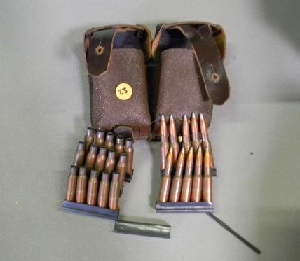 lot 23 image: Ammo pouch containing 10 live round...