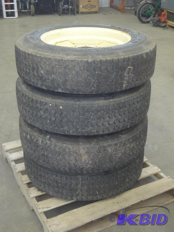 lot 41 image: (4) Used Skidloader Tires 8-Lug 22...
