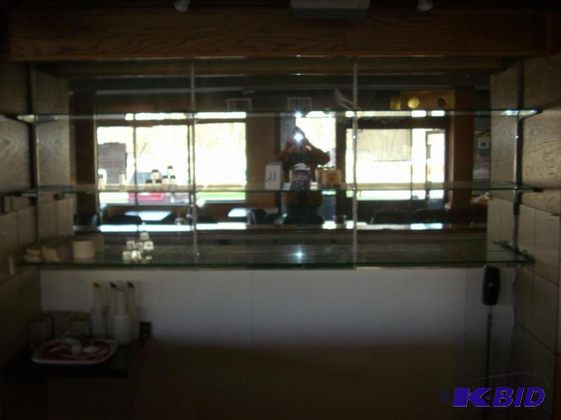 3 tier glass display with contents...