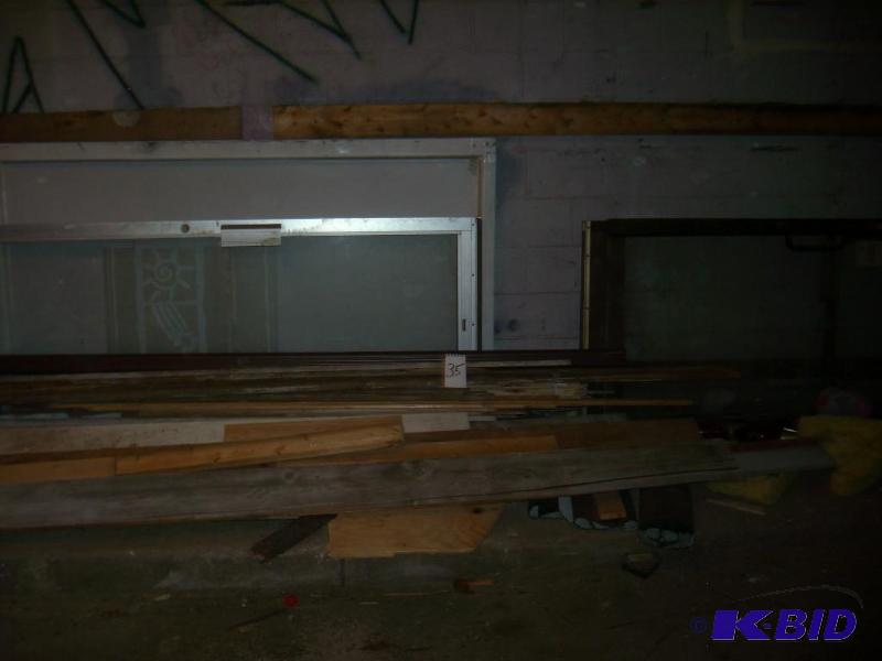 lumber with 3 aluminum doors...