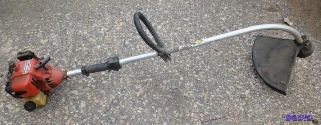 lot 54 image: Gas Powered Weed Trimmer In Used Co...