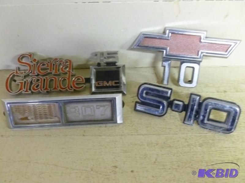 lot 202 image: Lot of four Chevy truck emblems....