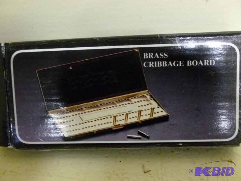 lot 233 image: Brass travel cribbage board, new in...