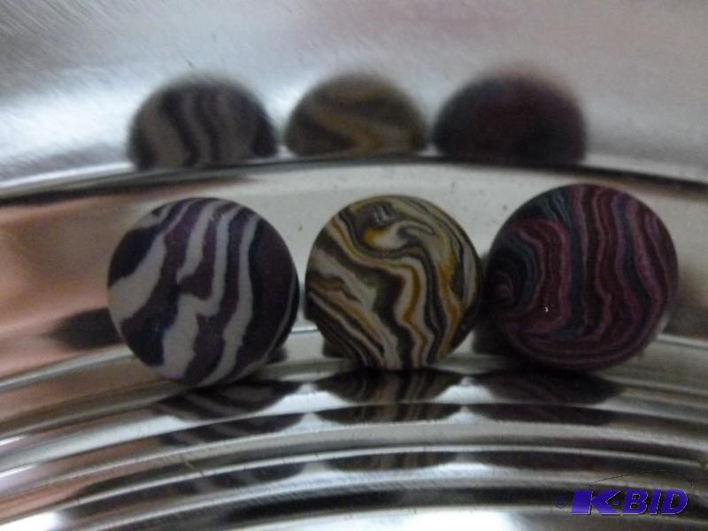 lot 309 image: Lot of three polymer clay marbles....