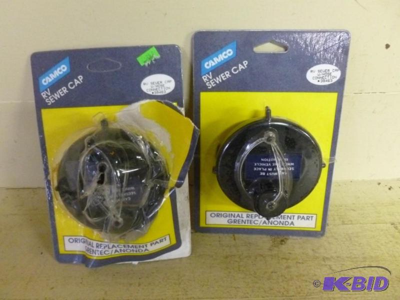 lot 82 image: Lot of two Camco RV sewer caps, one...