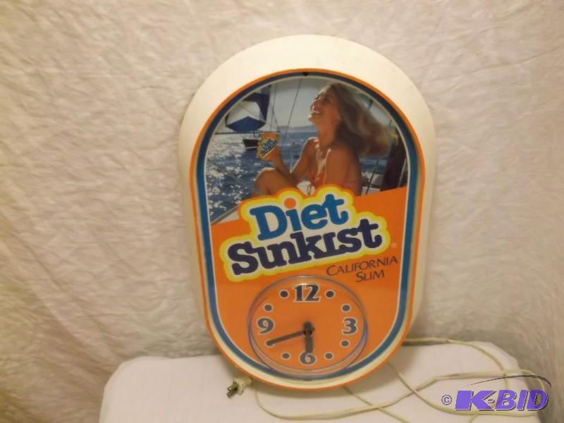 lot 35 image: Diet Sunkist clock  measuring ...