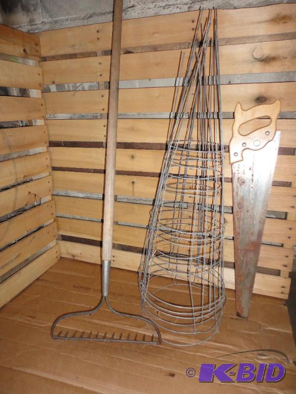 Rake, hand saw and tomato or plant ...