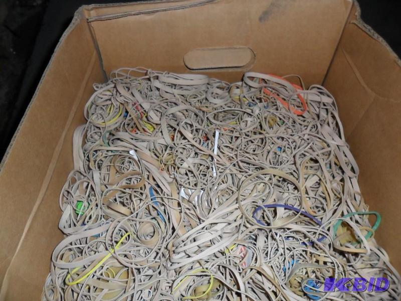 large box of used rubber bands. Lif...