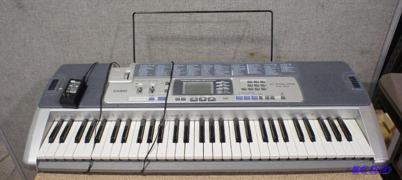 lot 36 image: Casio keyboard with stand and brack...