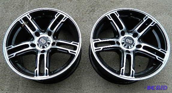 lot 22 image: ENKE rims (2) 15 x 7 aluminum rims ...
