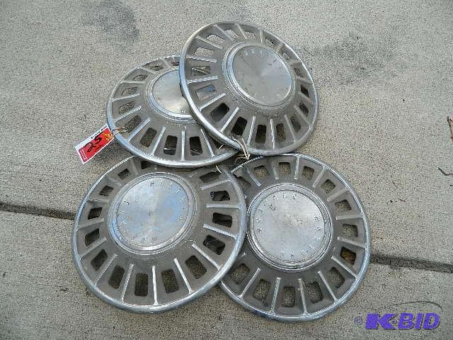 lot 25 image: 1965 Ford Mustang wheel covers. Ple...