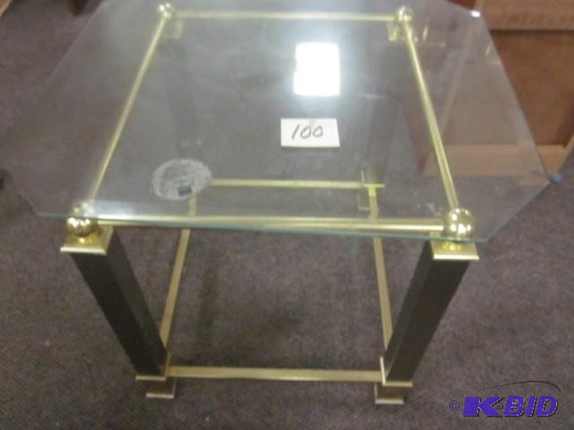 lot 100 image: Brass and glass end table....
