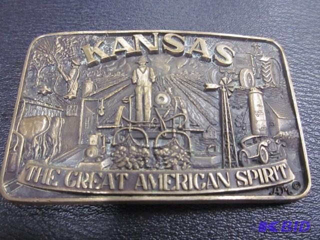 lot 17 image: Solid brass ADM Kansas belt buckle....