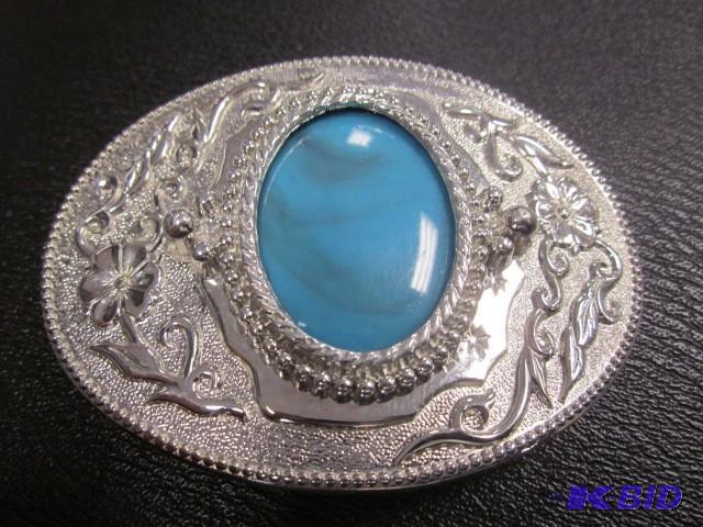 lot 23 image: Silver tone belt buckle with inlaye...