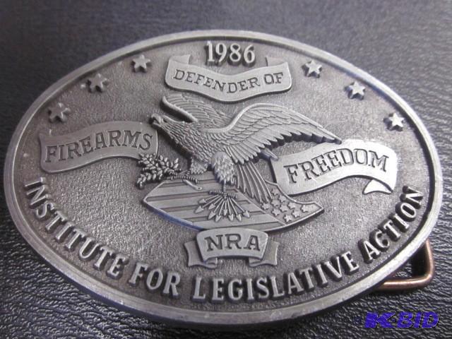 lot 29 image: 1986 NRA belt buckle. ...