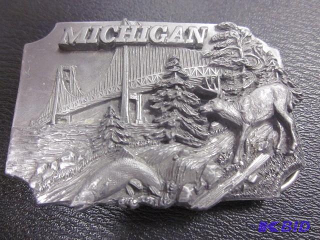 lot 38 image: 1989 Siskiyou Michigan belt buckle....