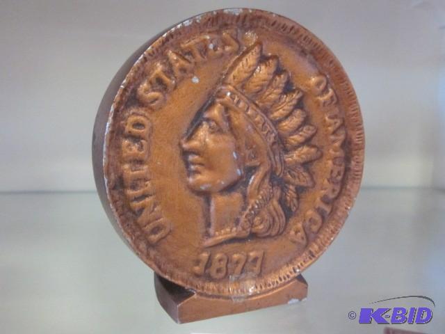 lot 48 image: Metal .01 cent Indian Head coin ban...
