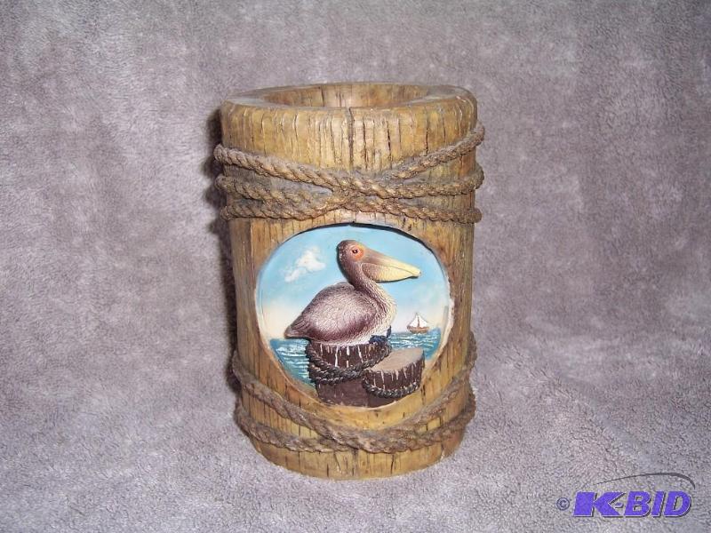 wood holder with pelican on front