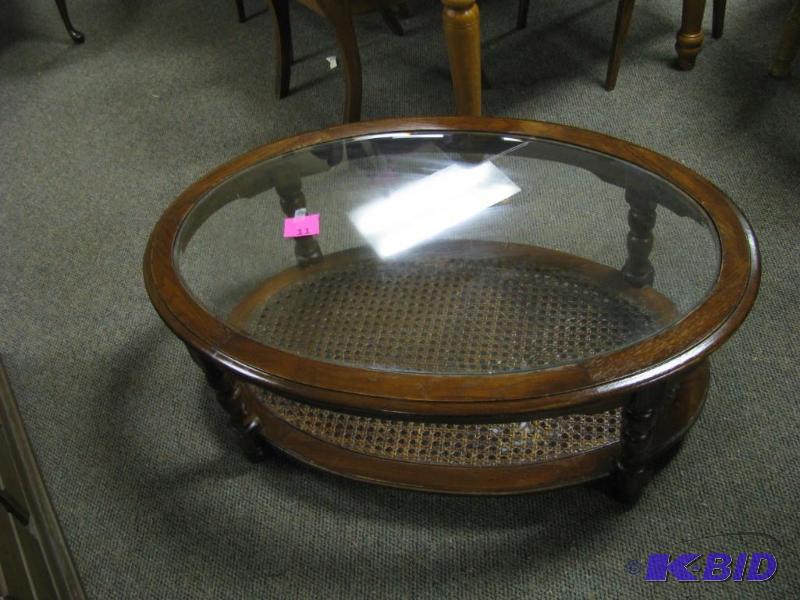 oval coffee table with beveled glas...