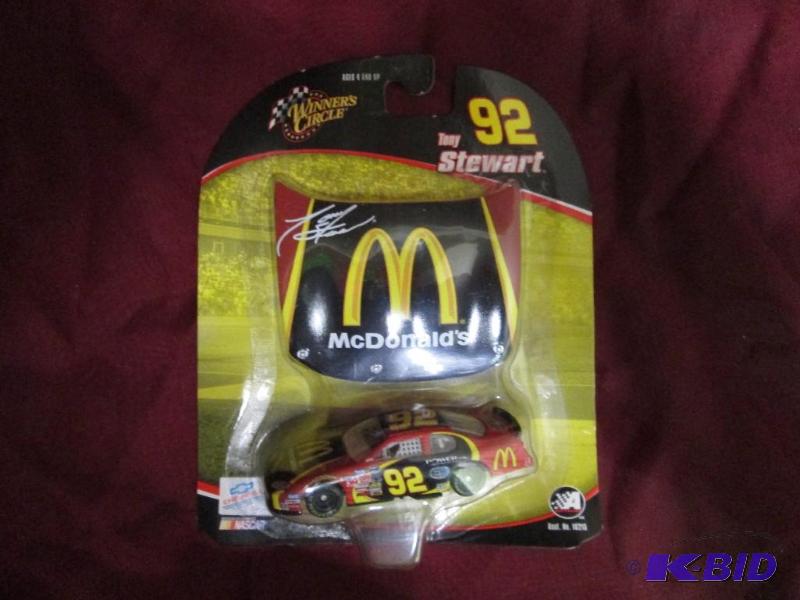 lot 66 image: NASCAR Tony Stewart car and race ho...