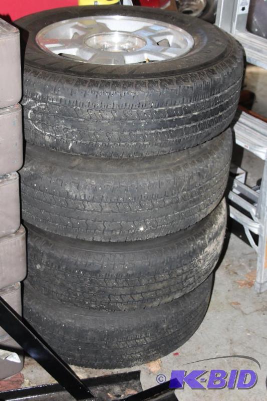 lot 4 image: Lot of (4) Ford Rims and Tires, 6 B...