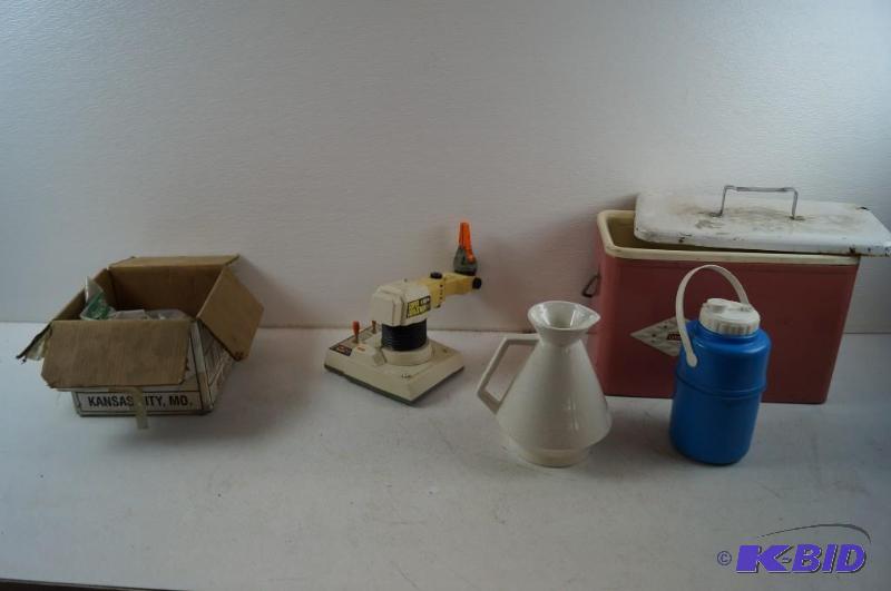 cable, toy, jug and Coleman cooler