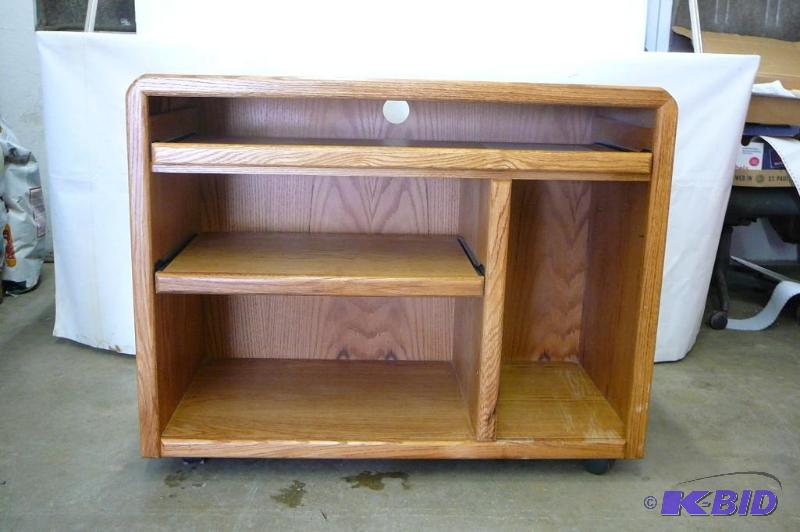 lot 10 image: Oak computer desk with casters and ...