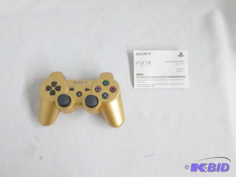 lot 29 image: Sony PS3 Gold Dualshock 3 Controller