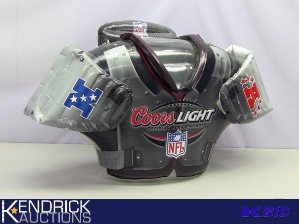 lot 11 image: Coors Light Blow Up Football Shoulder Pads Advertising