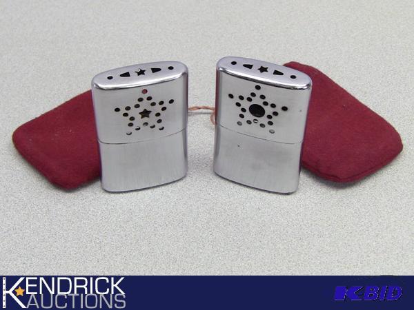 lot 24 image: Pair of Vintage Pocket Hand Warmers