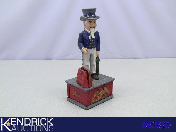lot 27 image: Cast Iron Uncle Sam Bank Replica
