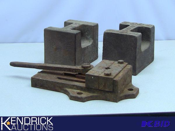 lot 31 image: Cast Iron Lot of 2 50 lb Antique Horse Drops and a Metal Vice Type Tool