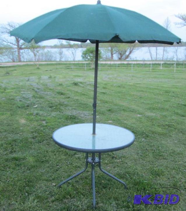 lot 109 image: Glass top table with folding umbrel...