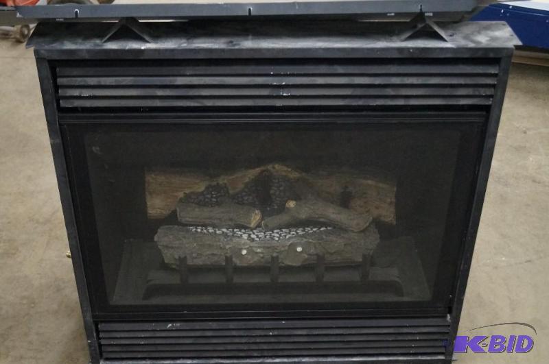 A propane gas fire insert. It measu...