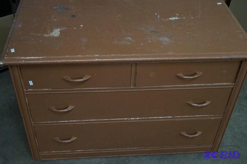 A antique Dresser. It has 4 drawers...