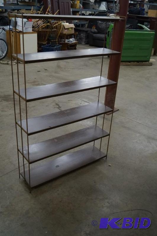 A metal shelf has a total of 6 shel...