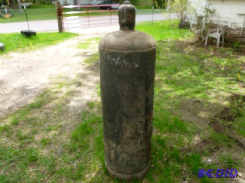 lot 151 image: Large 100 lbs propane cylinder with...