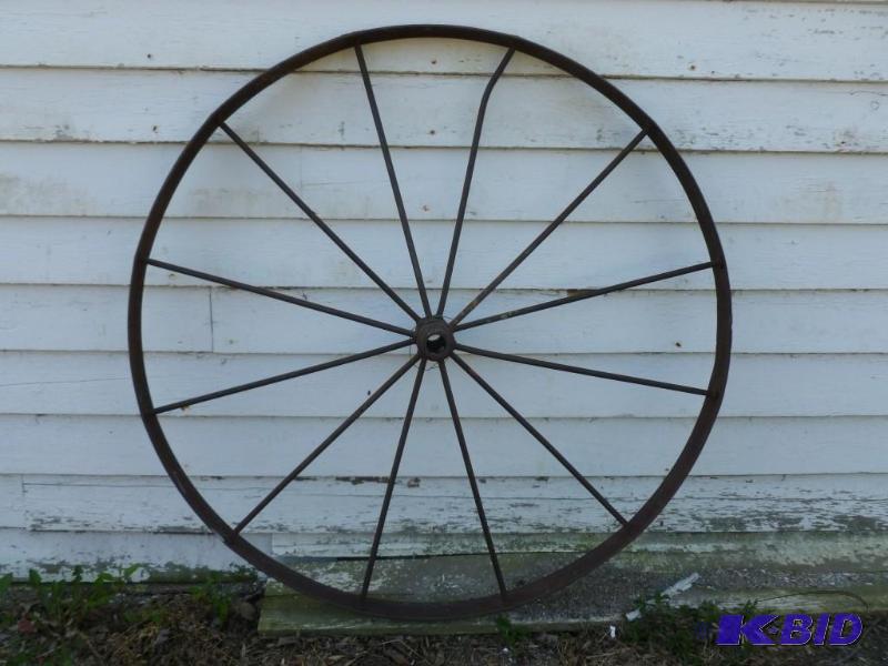 lot 17 image: Large antique steel wagon wheel tha...