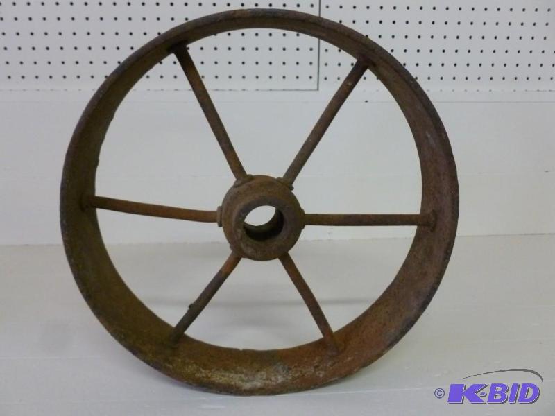 lot 18 image: Antique steel wheel that measures 1...