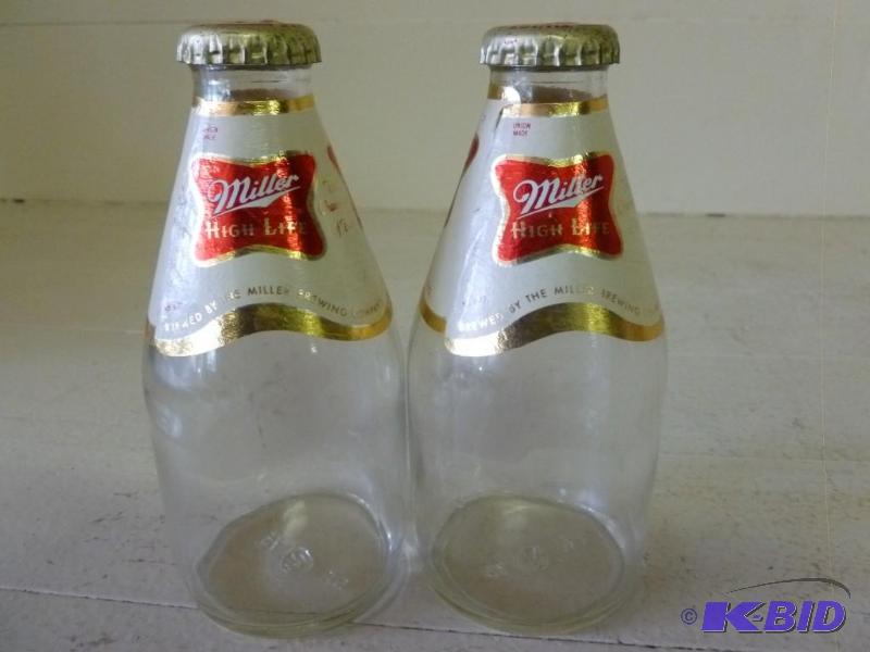 lot 320 image: A pair of Miller High Life beer bot...
