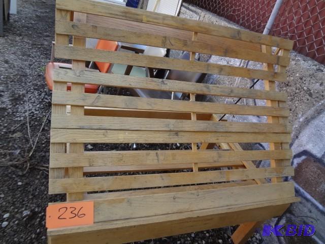lot 236 image: Tilt top wooden table on wheels...