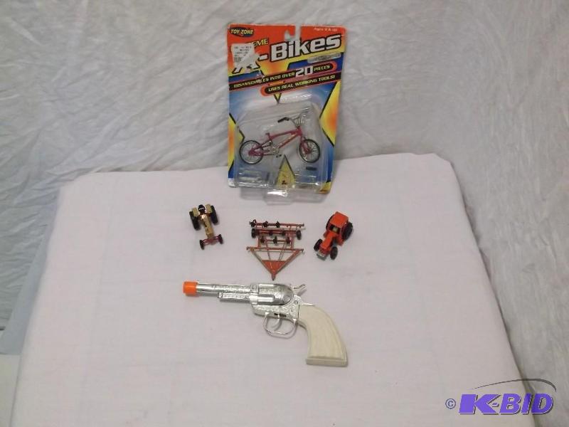 Lot with cap gun and Die cast toys....