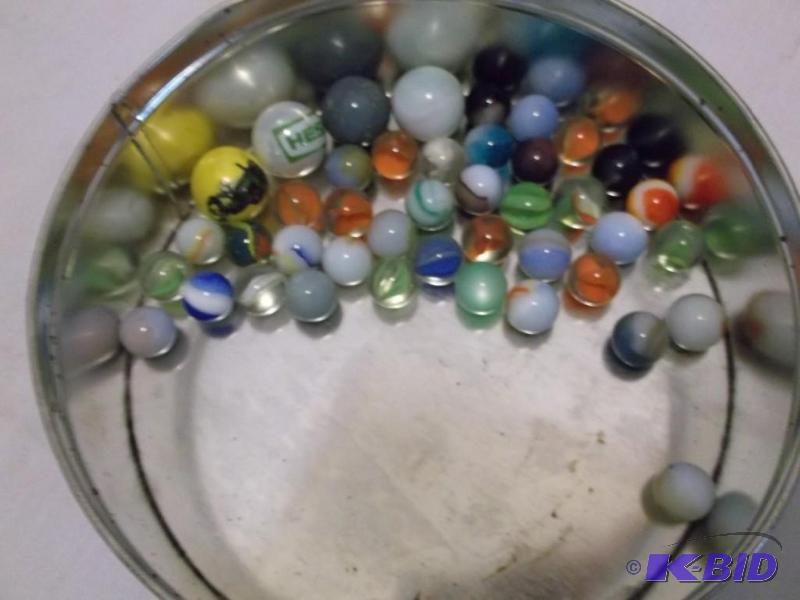 Tin with shooters &amp marbles....
