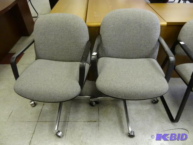 2 matching office chairs on wheels...